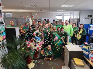 Go Green Day in the Chelmsford office, dressed in green with falling confetti