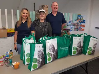Resilium one meal food relief volunteers group with bags of food in Sydney, Australia