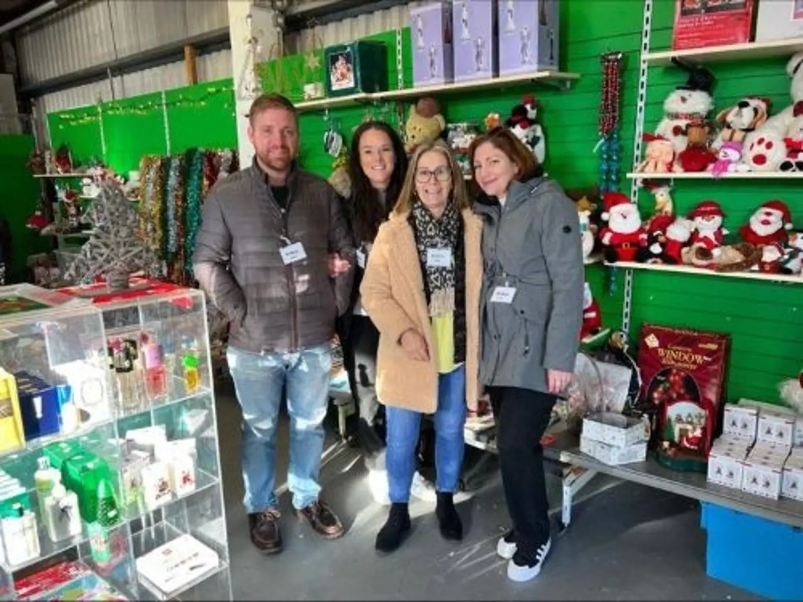 Four Robus Guernsey volunteers at GO Charities Christmas shop providing furniture and goods to locals in need