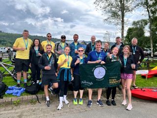 Ardonagh Specialty team standing together with drinks at the Finish Line