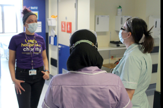 Volunteer from Leeds Hospital's Charity pictured with medical staff