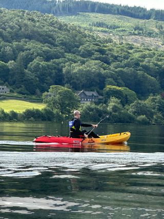 Ardonagh Specialty colleague in a kayak on the lake