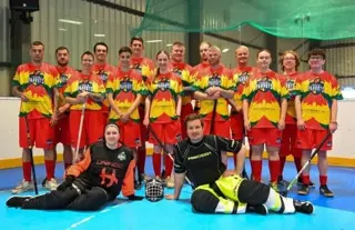 Perth Parrots, Scotland, LGBTQ+ floorball team shot in kit on rink